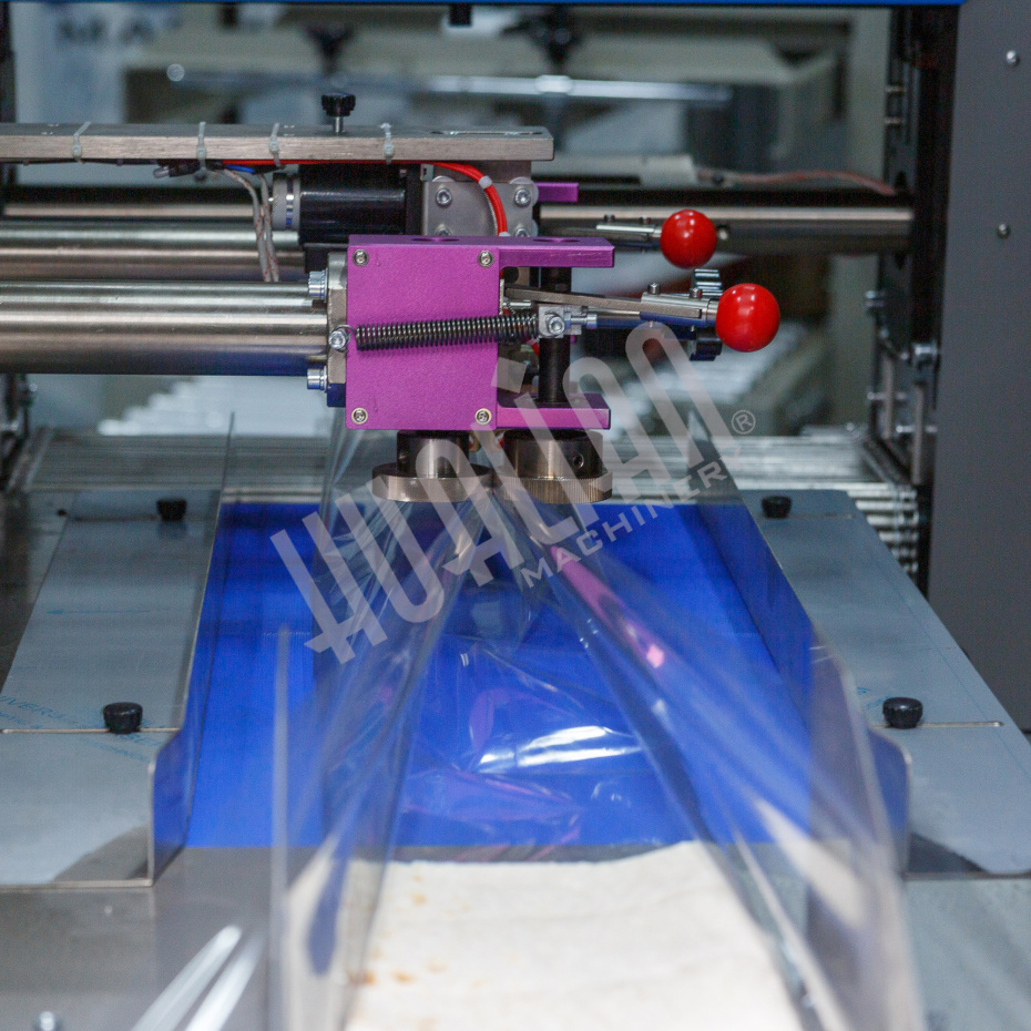 Горизонтальная упаковочная машина DXDZ-600XD (3 серв., H-110 мм, L не огр., W 145-285 мм, HL-1108, круг. отв., подбой, прок. пакета) Hualian - Купить с доставкой по всему Казахстану