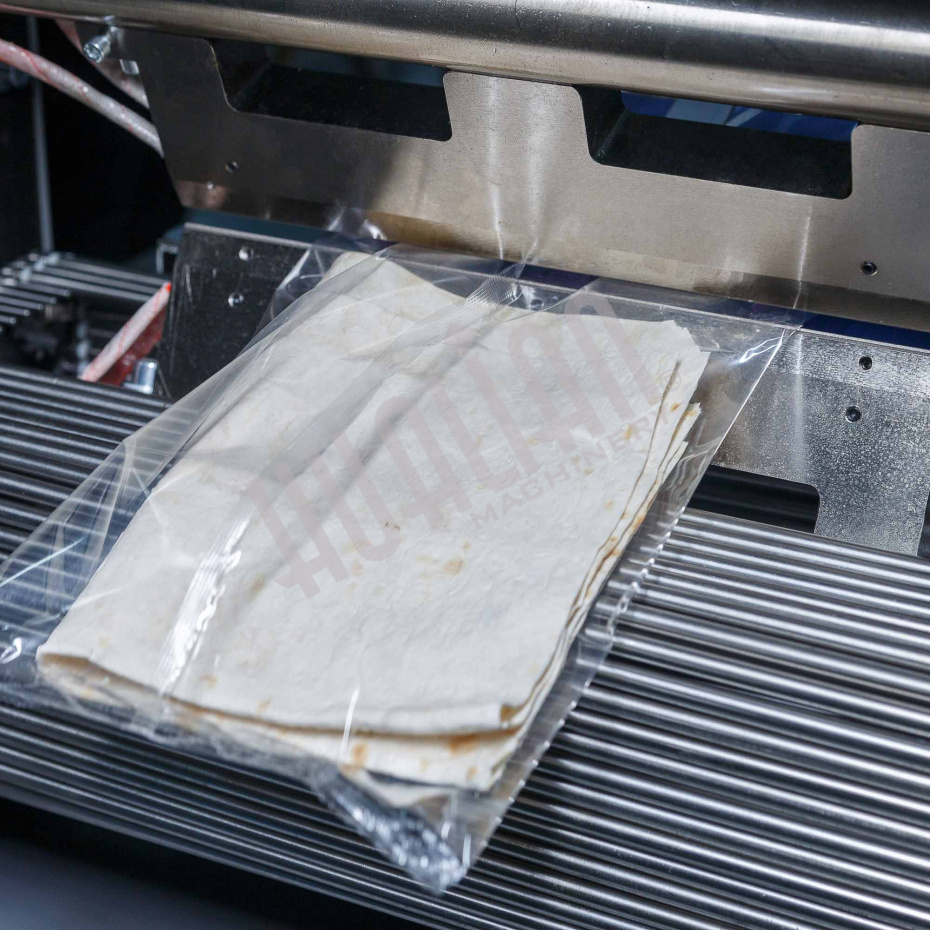 Горизонтальная упаковочная машина DXDZ-600XD (лент. 250 мм, рег.форм., S 400, L 180-500, H-120, трансп.попереч.запайки) Hualian - Купить с доставкой по всему Казахстану