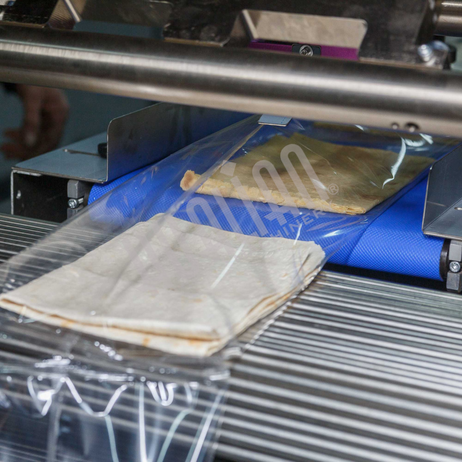 Горизонтальная упаковочная машина DXDZ-600XD (лент. 250 мм, рег.форм., S 400, L 180-500, H-120, трансп.попереч.запайки) Hualian - Купить с доставкой по всему Казахстану