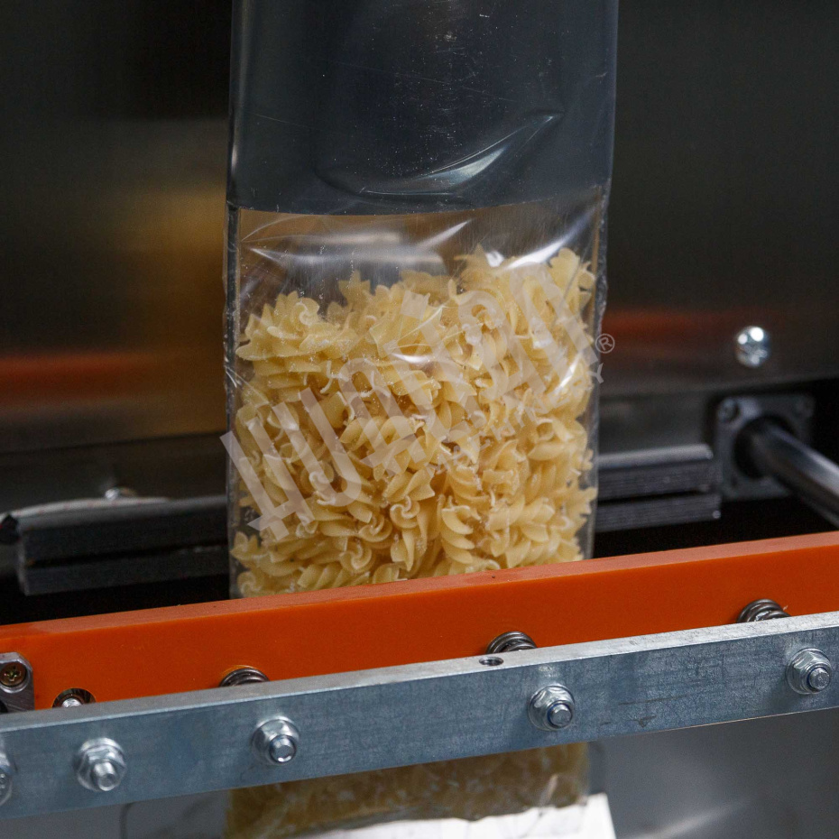 Автоматическая фасовочно-упаковочная машина DXDK-1000 NEW (пакет подушка, ширина пленки 300 мм, фотодатчик) Hualian - Купить с доставкой по всему Казахстану