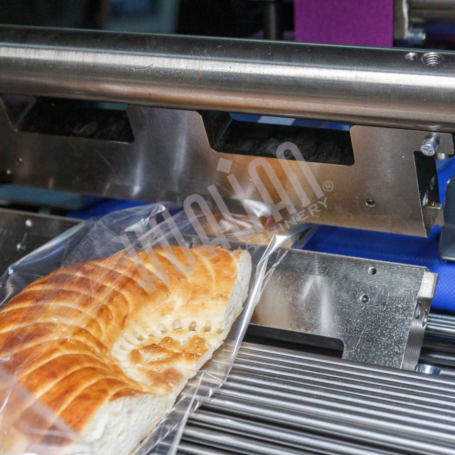 Горизонтальная упаковочная машина DXDZ-600XD (лент. 250 мм, рег.форм., S 400, L 180-500, H-120, трансп.попереч.запайки) Hualian - Купить с доставкой по всему Казахстану