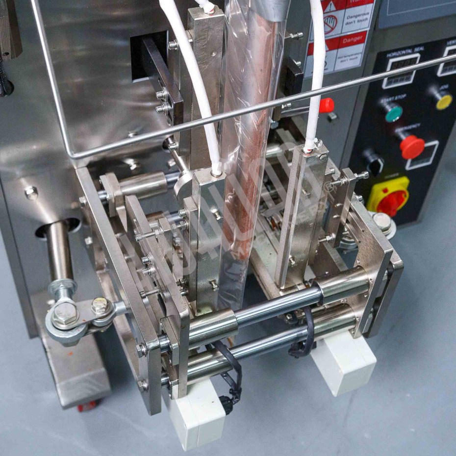 Машина для упаковки трудно-сыпучих продуктов и порошков DXDF-100AX (15-100 мл,4-х шовн., шир.пленки 240 мм, насечка, датер HP-241G, зубчатый нож, шов  Hualian - Купить с доставкой по всему Казахстану